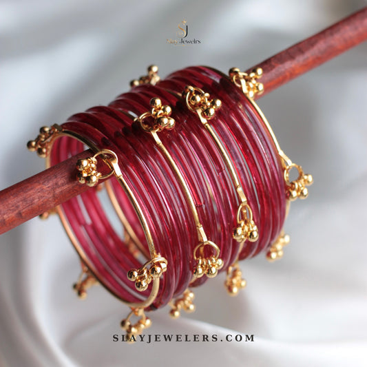 Maroon jelly bangles with gold Kashmiri floral charms — Slay Jewelers
