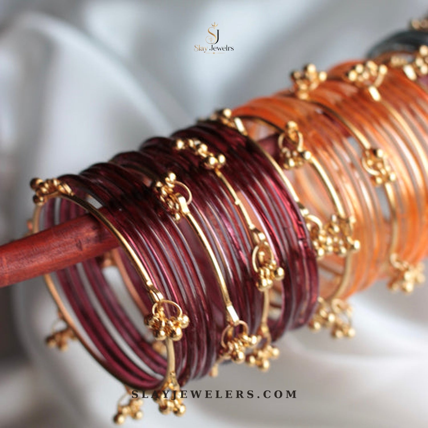 Maroon and orange amber jelly bangles with gold Kashmiri charms — Slay Jewelers