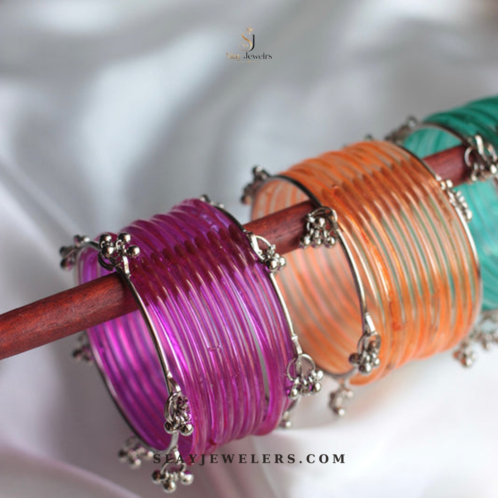 Purple, orange, and teal jelly bangle trio with silver Kashmiri charms — Slay Jewelers