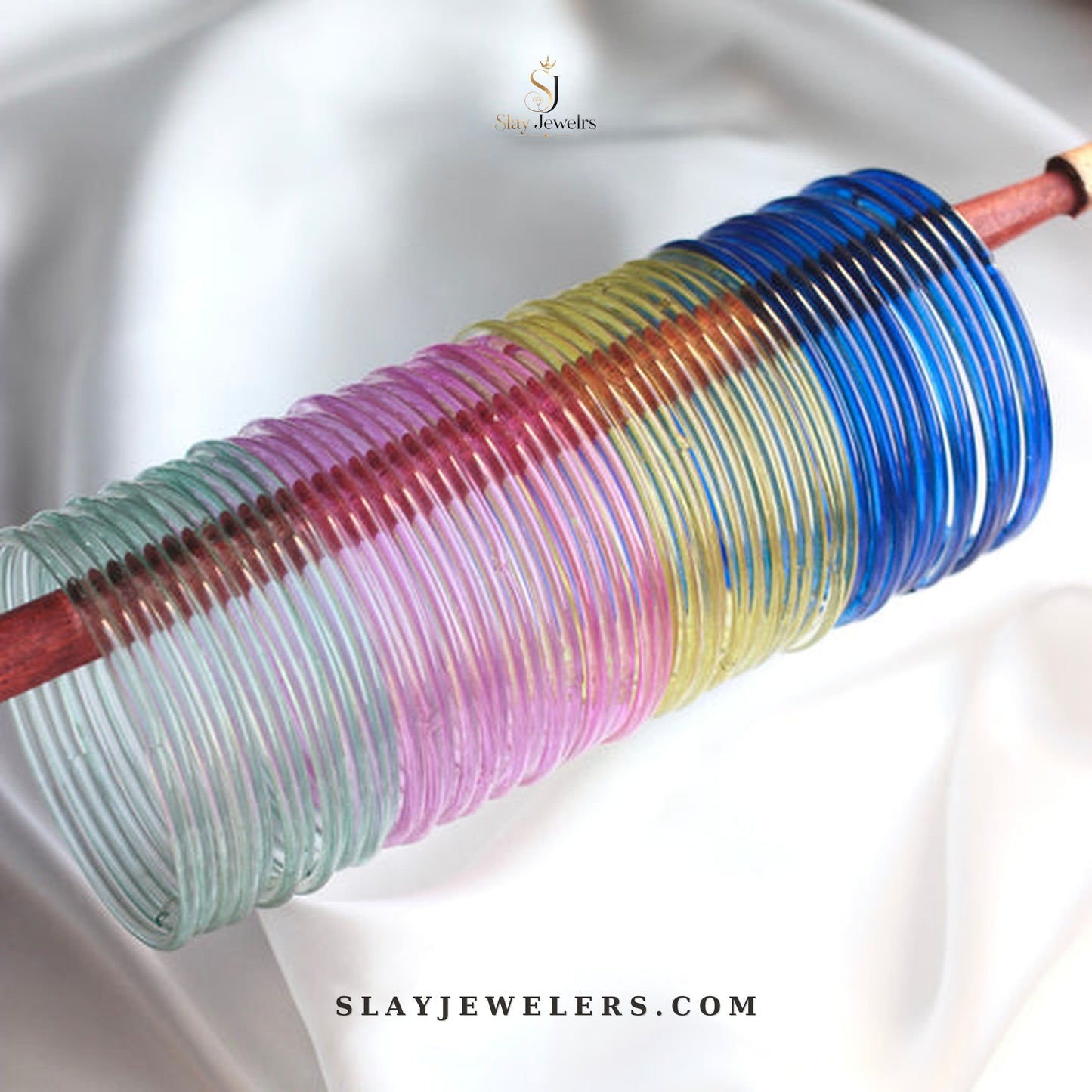 Pastel rainbow jelly bangles in teal, pink, yellow, and royal blue — Slay Jewelers
